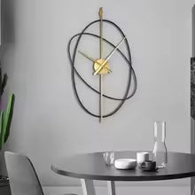 Grande Horloge Murale Ovale en Métal Design Moderne